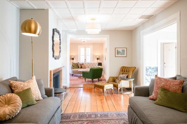 living room with hardwood / wood-style floors and french doors