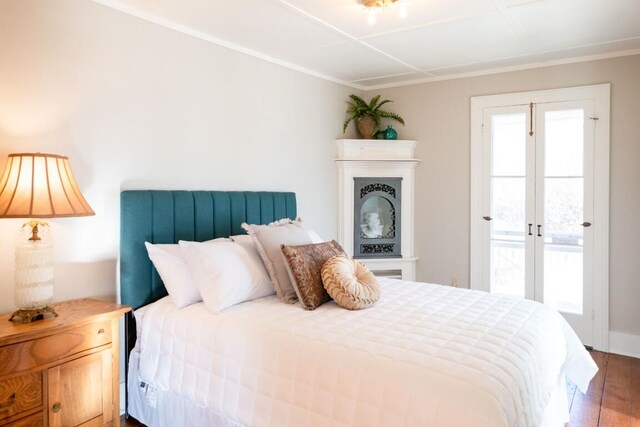 bedroom with hardwood / wood-style flooring, access to exterior, and french doors