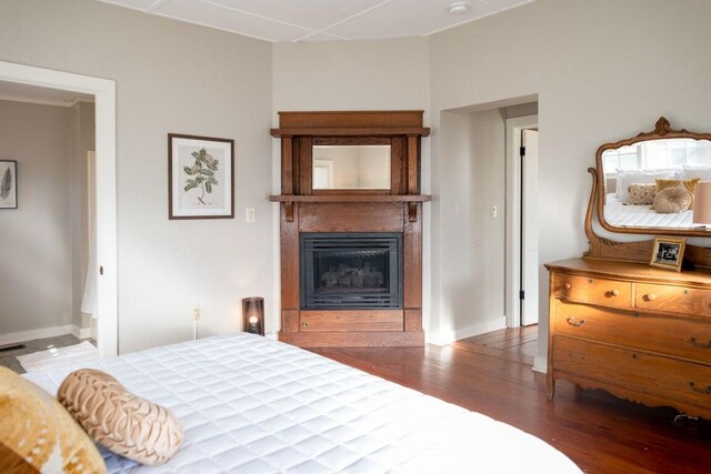 bedroom featuring dark hardwood / wood-style flooring