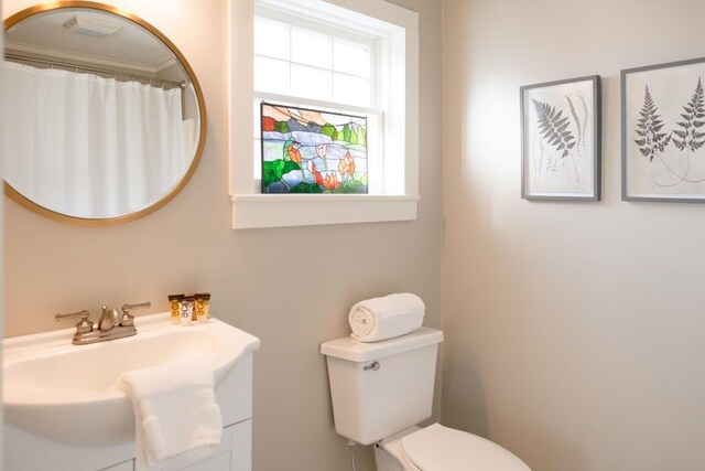 bathroom featuring vanity and toilet