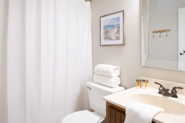 bathroom with vanity and toilet