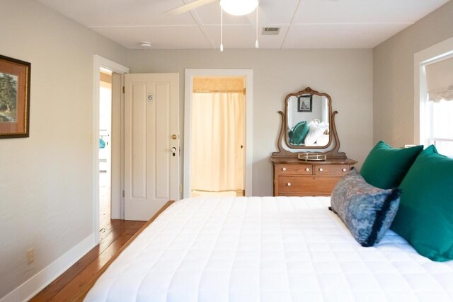 bedroom with light wood-type flooring and ceiling fan