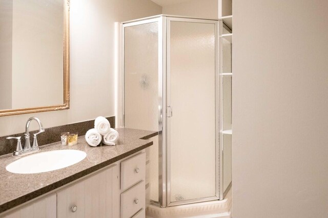 bathroom featuring vanity and walk in shower