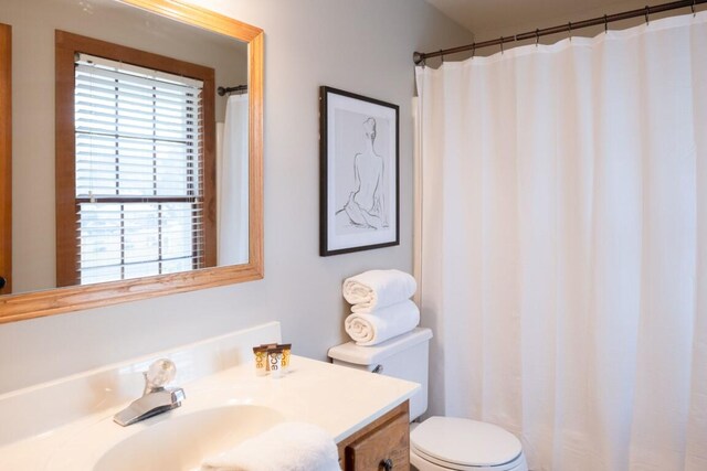 bathroom with vanity and toilet