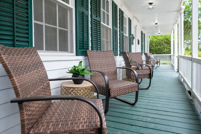 wooden deck featuring covered porch