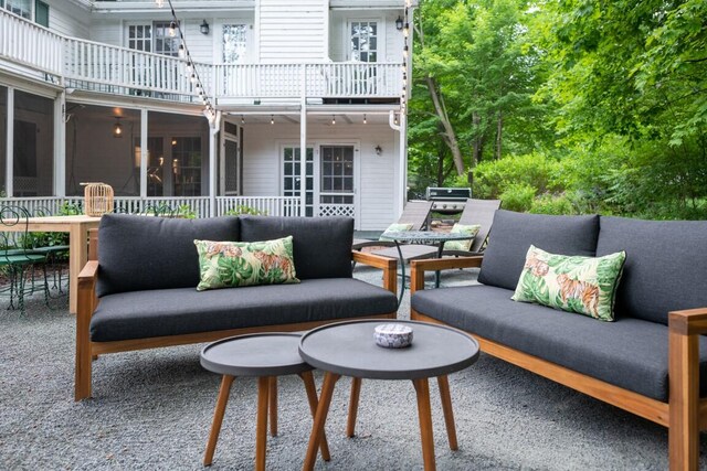 view of patio / terrace featuring an outdoor living space and a balcony