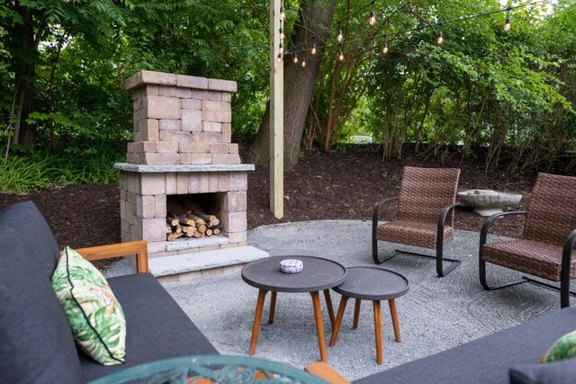 view of patio / terrace with an outdoor stone fireplace