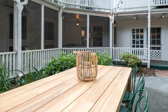 wooden terrace featuring a sunroom