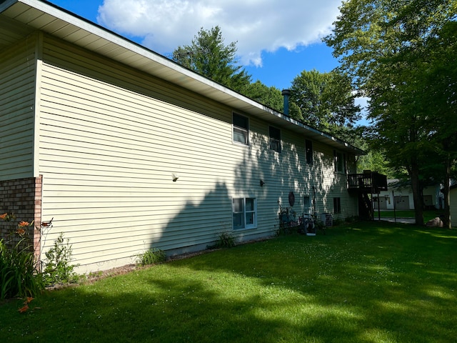 view of property exterior featuring a yard