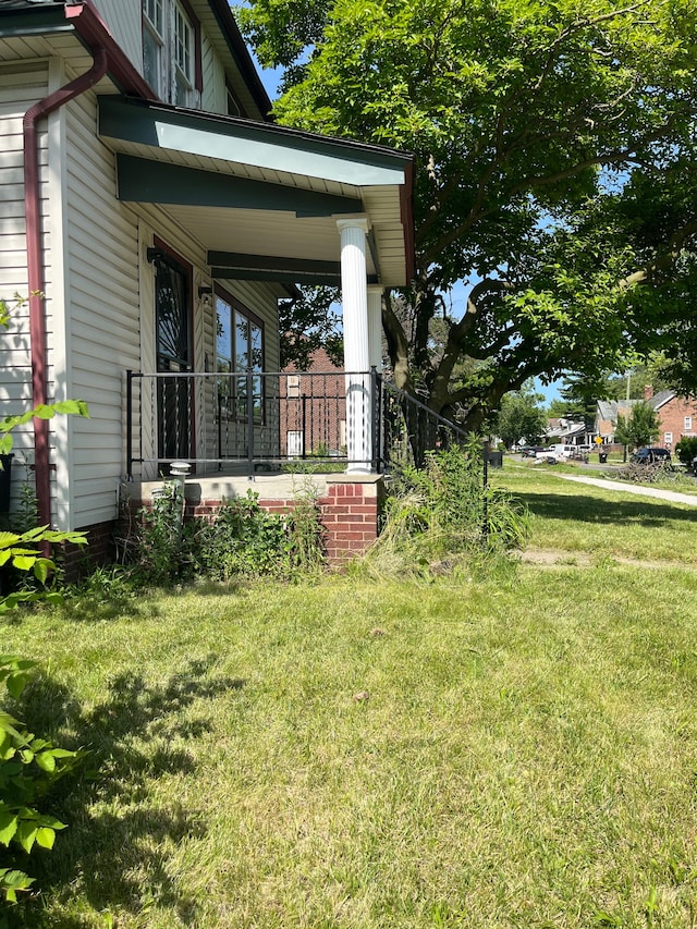 view of yard with covered porch