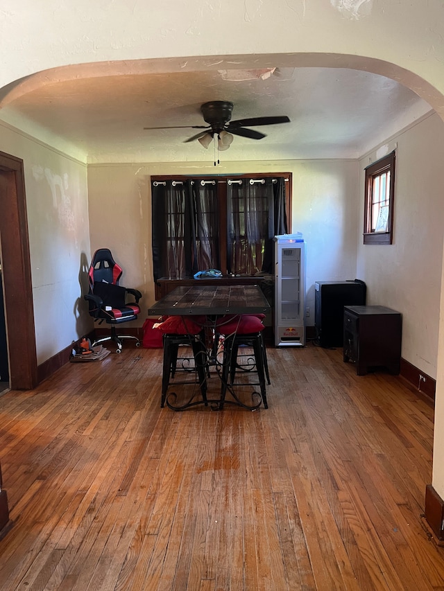 dining space with hardwood / wood-style flooring and ceiling fan