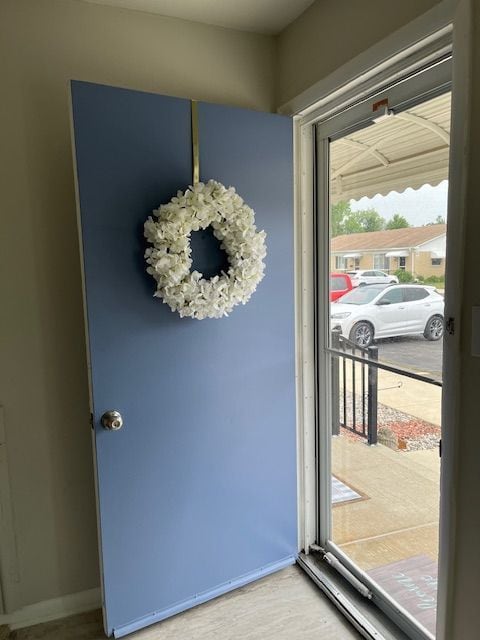 doorway to outside featuring wood-type flooring