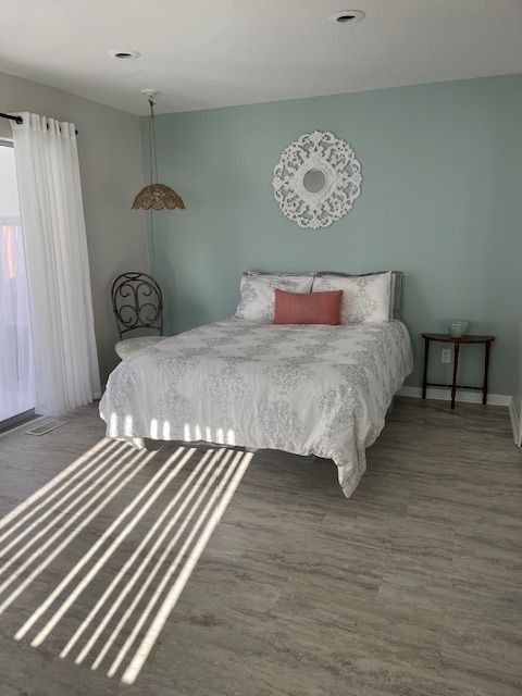 bedroom featuring wood-type flooring