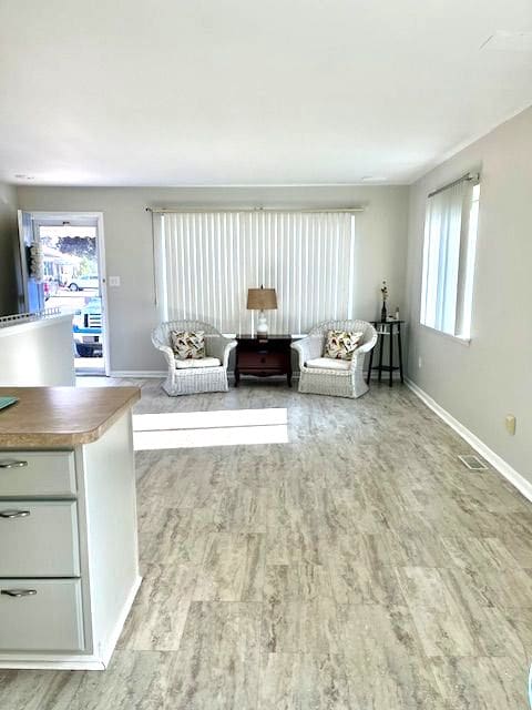 unfurnished living room featuring hardwood / wood-style flooring