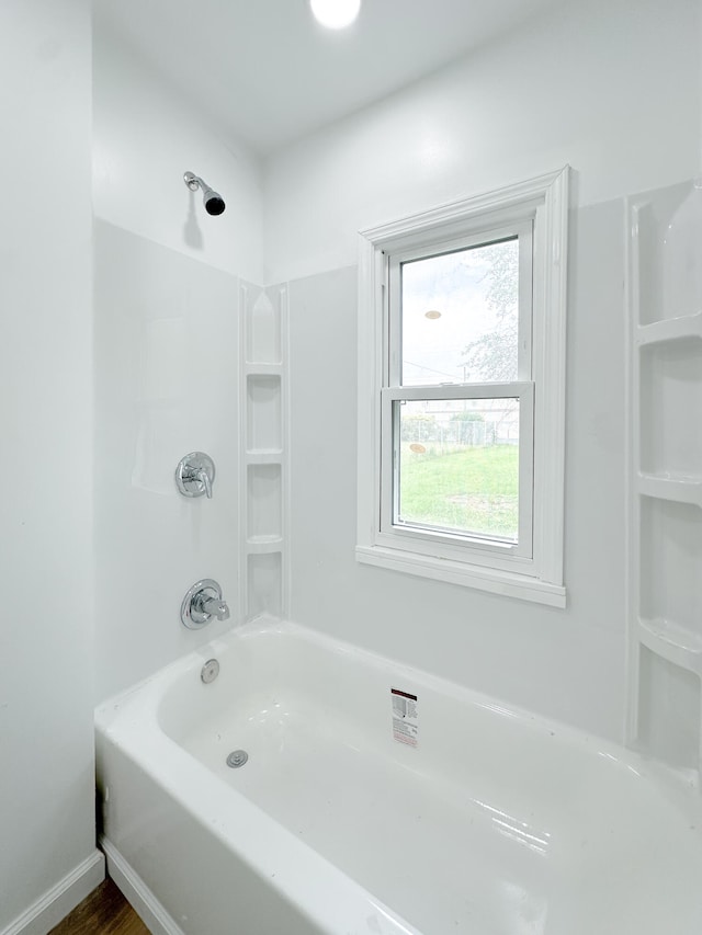 bathroom with shower / washtub combination