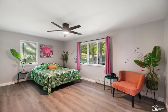 bedroom with hardwood / wood-style flooring and ceiling fan