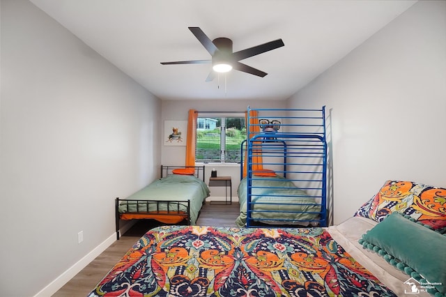 bedroom featuring dark hardwood / wood-style floors and ceiling fan