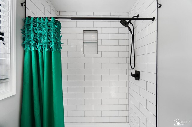 bathroom featuring walk in shower