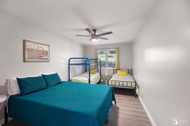 bedroom with wood-type flooring and ceiling fan