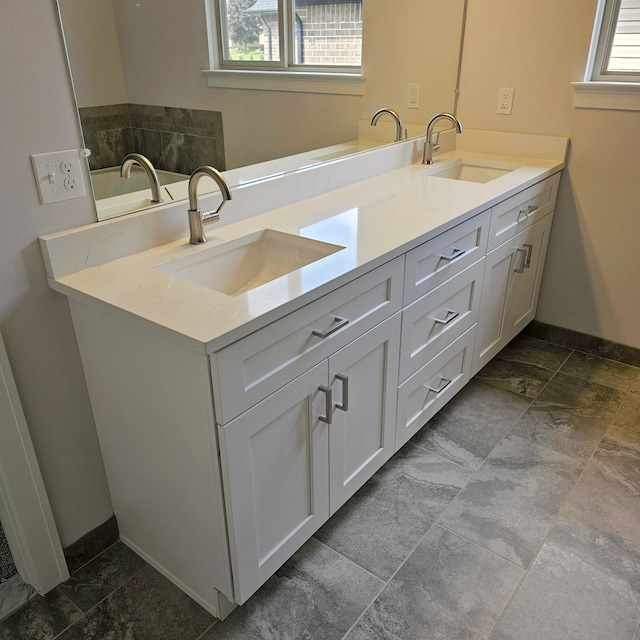 bathroom featuring plenty of natural light and vanity