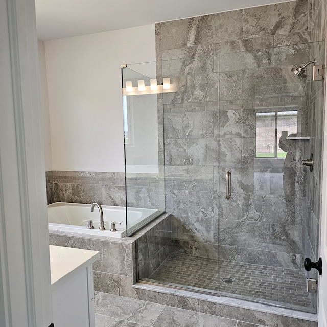 bathroom featuring vanity and plus walk in shower