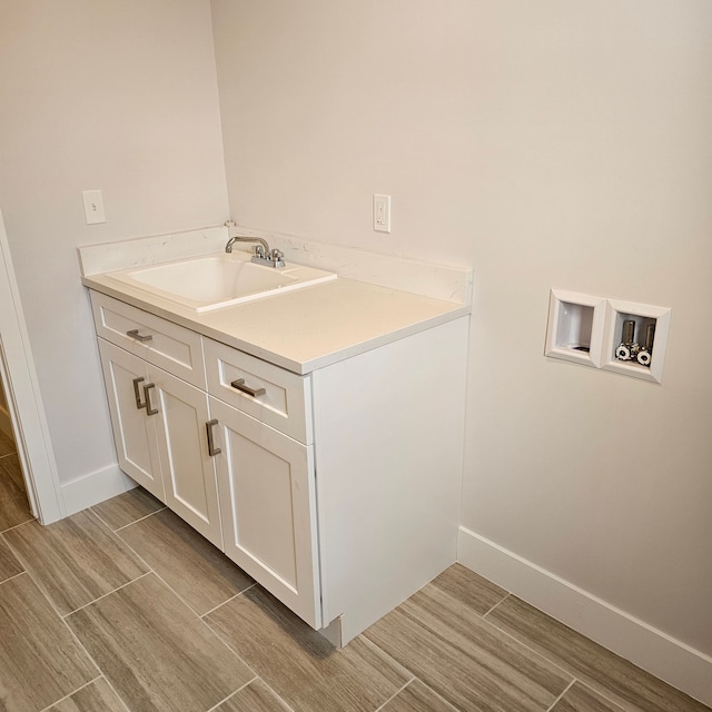 laundry area with sink and hookup for a washing machine