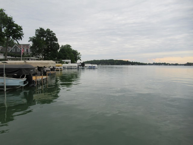 property view of water featuring a dock