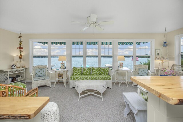21945 Howell Dr, Cassopolis, MI 49031 - carpeted living area with ceiling fan and a water view