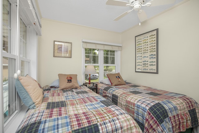 bedroom featuring a textured ceiling, ceiling fan, and crown molding