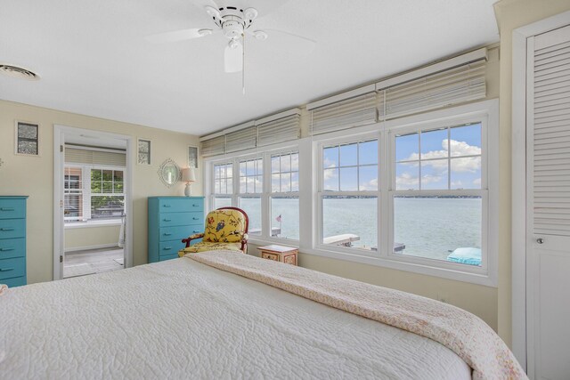 21945 Howell Dr, Cassopolis, MI 49031 - bedroom featuring a water view and a ceiling fan