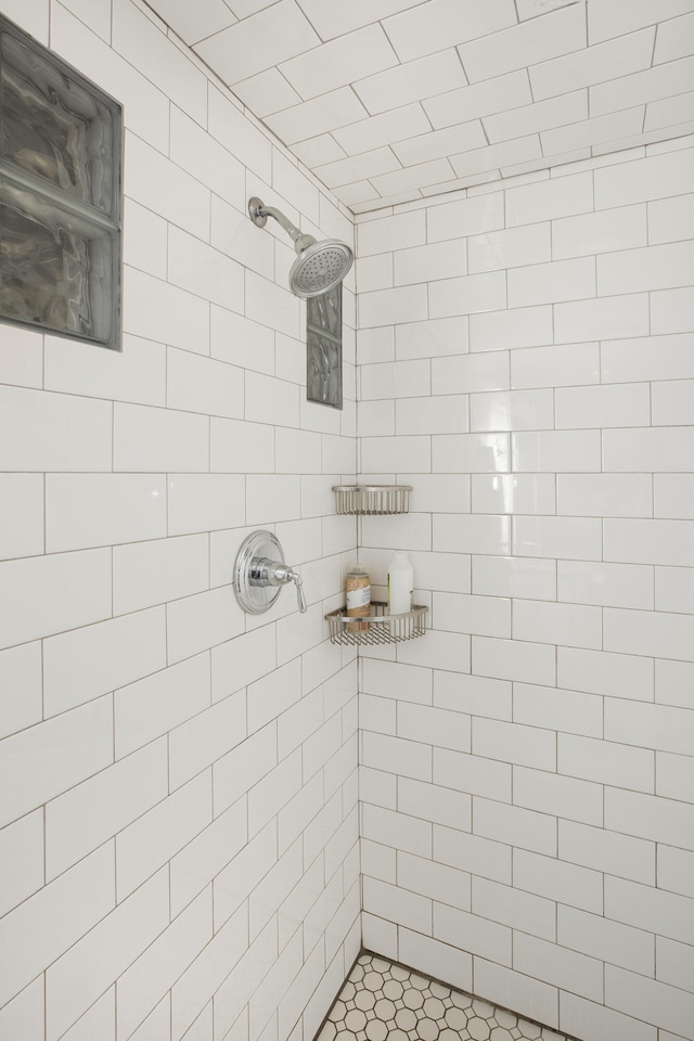 bathroom with tiled shower