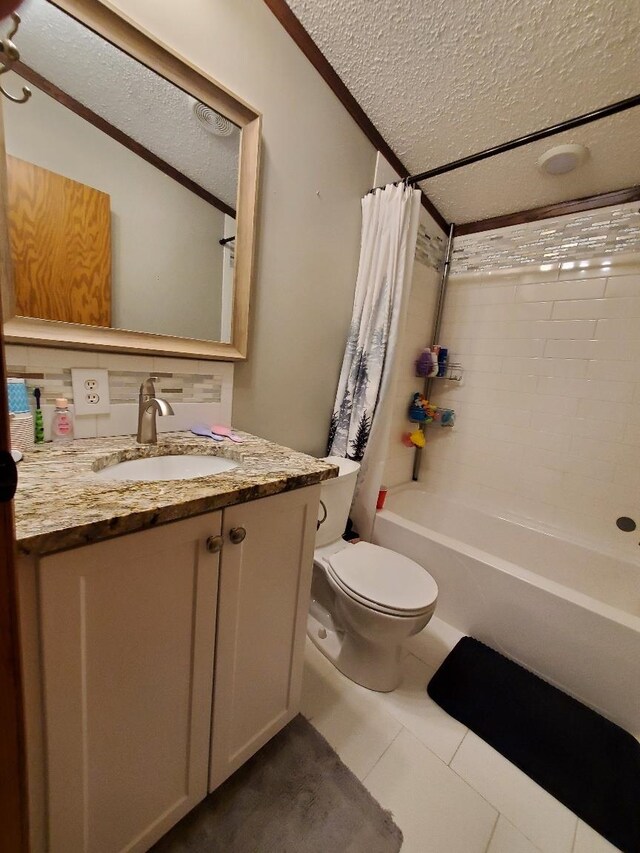 5232 E Broadway, Mount Pleasant, MI 48858 - full bath with a textured ceiling, vanity, shower / tub combo with curtain, toilet, and tile patterned flooring