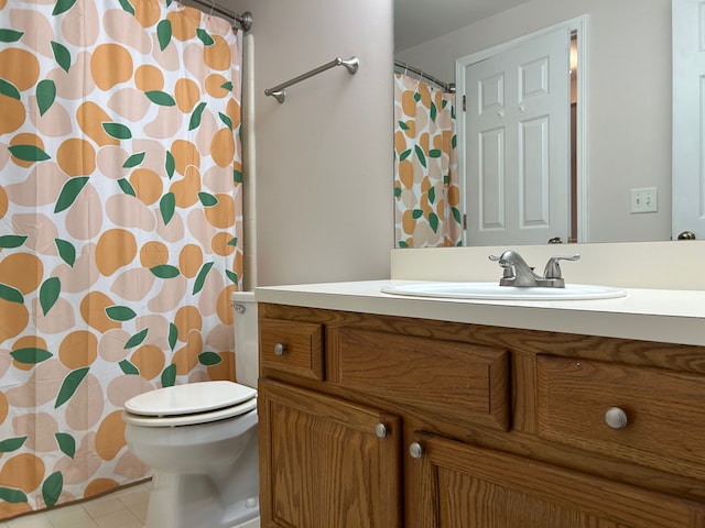 bathroom with tile patterned floors, vanity, a shower with shower curtain, and toilet