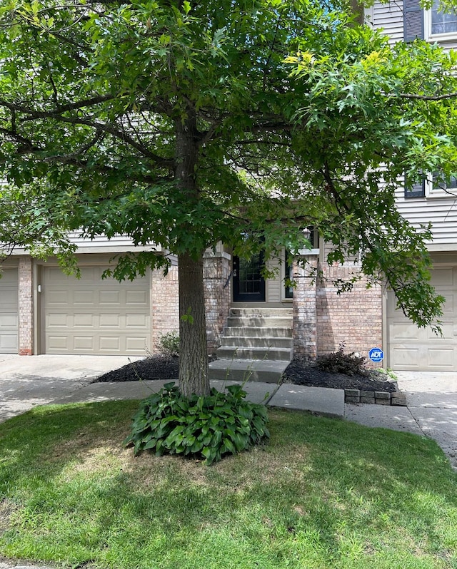 obstructed view of property featuring a garage