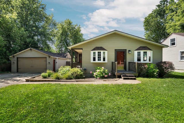 view of front facade with a garage, an outdoor structure, and a front lawn