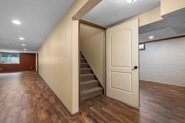 stairs featuring hardwood / wood-style floors