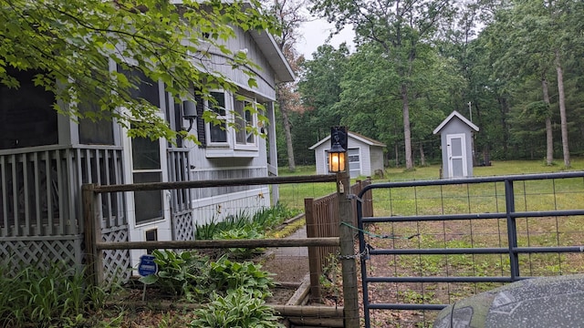 view of gate with a storage shed