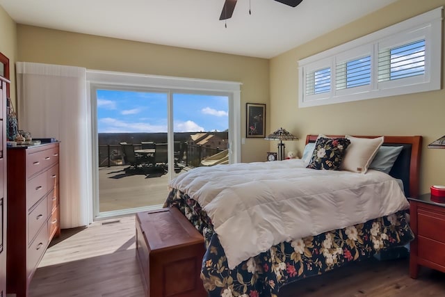 bedroom featuring access to exterior, ceiling fan, and wood-type flooring