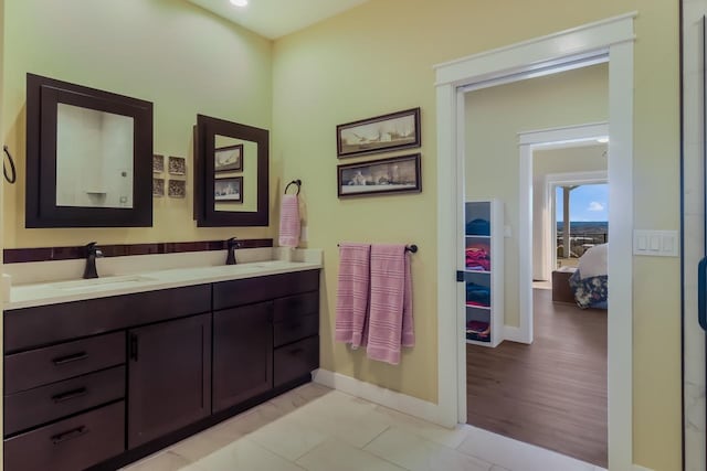 bathroom with wood-type flooring and vanity