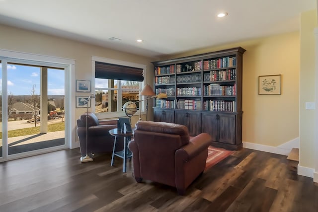 living area with dark hardwood / wood-style floors