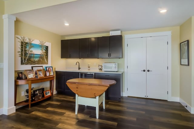 kitchen with dark hardwood / wood-style flooring and sink