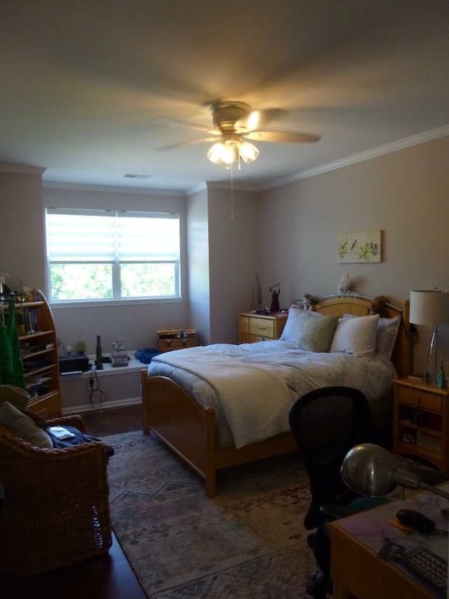 bedroom featuring ceiling fan and ornamental molding