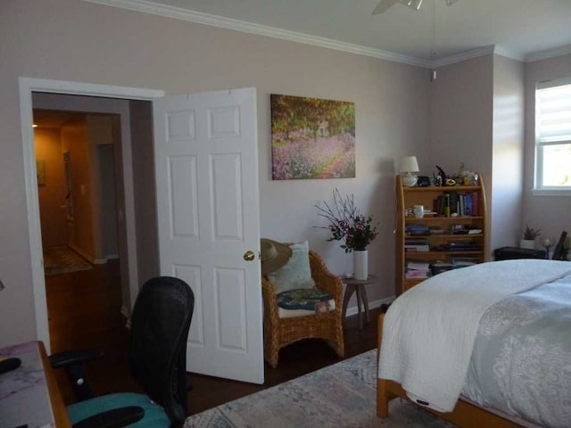 bedroom featuring crown molding, ceiling fan, and dark hardwood / wood-style floors