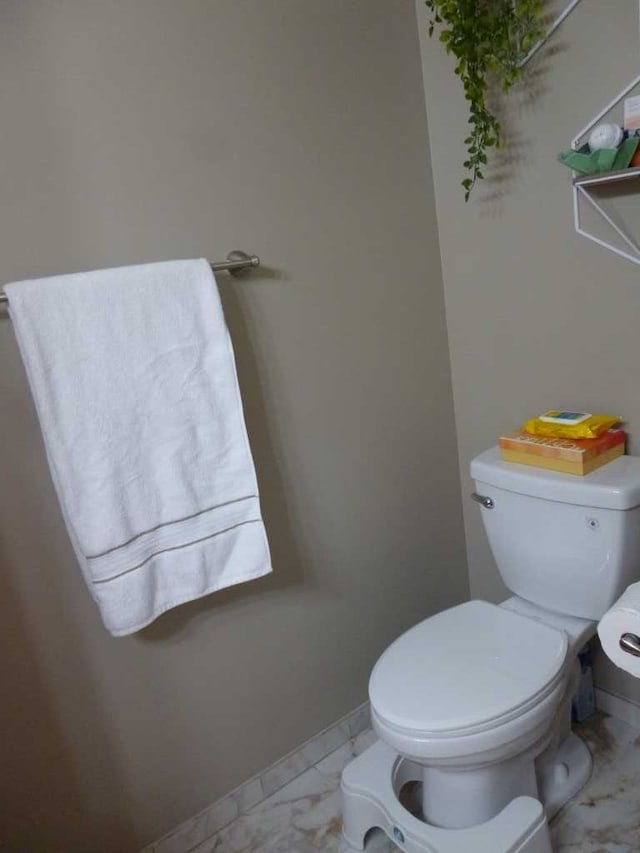 bathroom featuring toilet