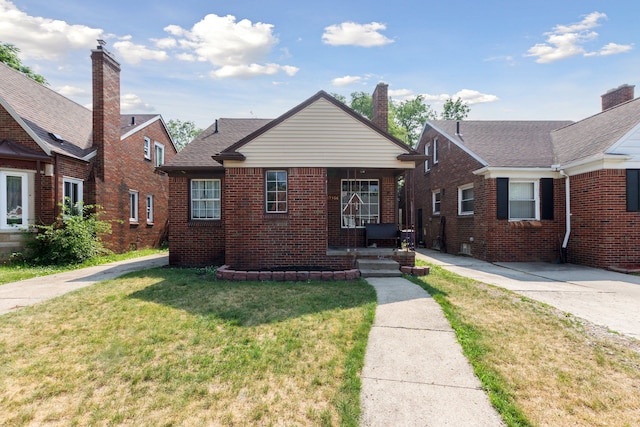 bungalow with a front lawn