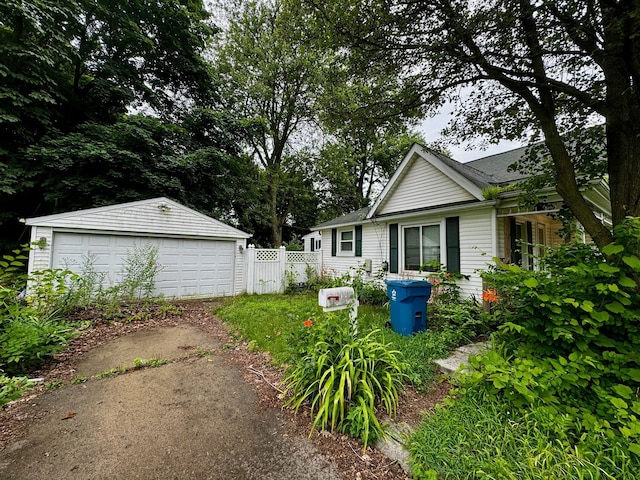 exterior space with an outbuilding and a garage