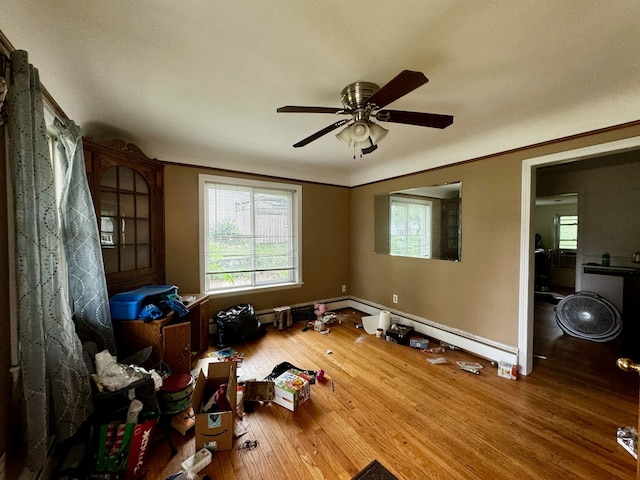 misc room with ceiling fan and hardwood / wood-style floors