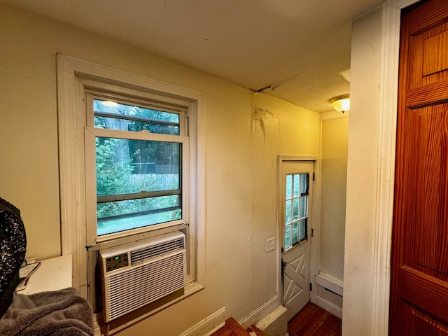 entryway with hardwood / wood-style floors and a healthy amount of sunlight