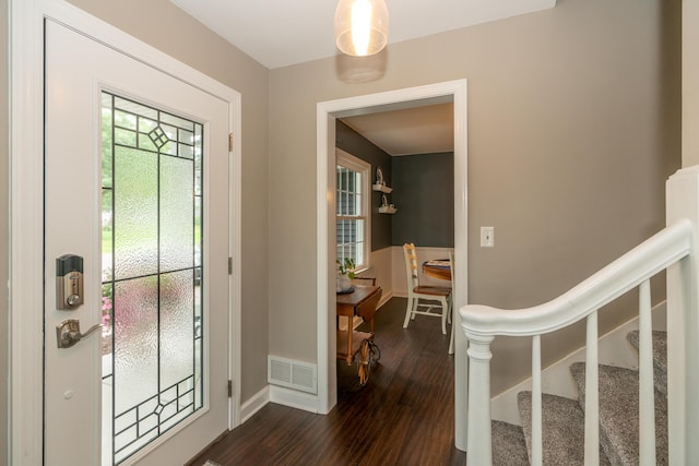 609 3rd St, Muskegon, MI 49445 - foyer featuring dark wood-type flooring and baseboards