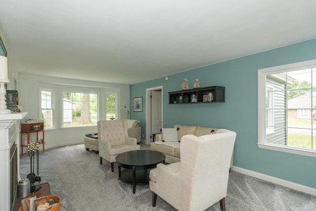 609 3rd St, Muskegon, MI 49445 - living area with plenty of natural light, carpet, and baseboards